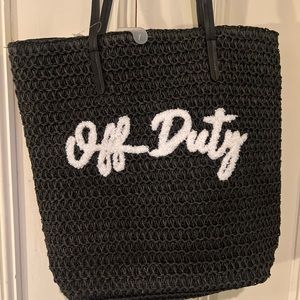 Adorable NWT “off duty” black straw beach bag or off shirt bag. Love this!!!